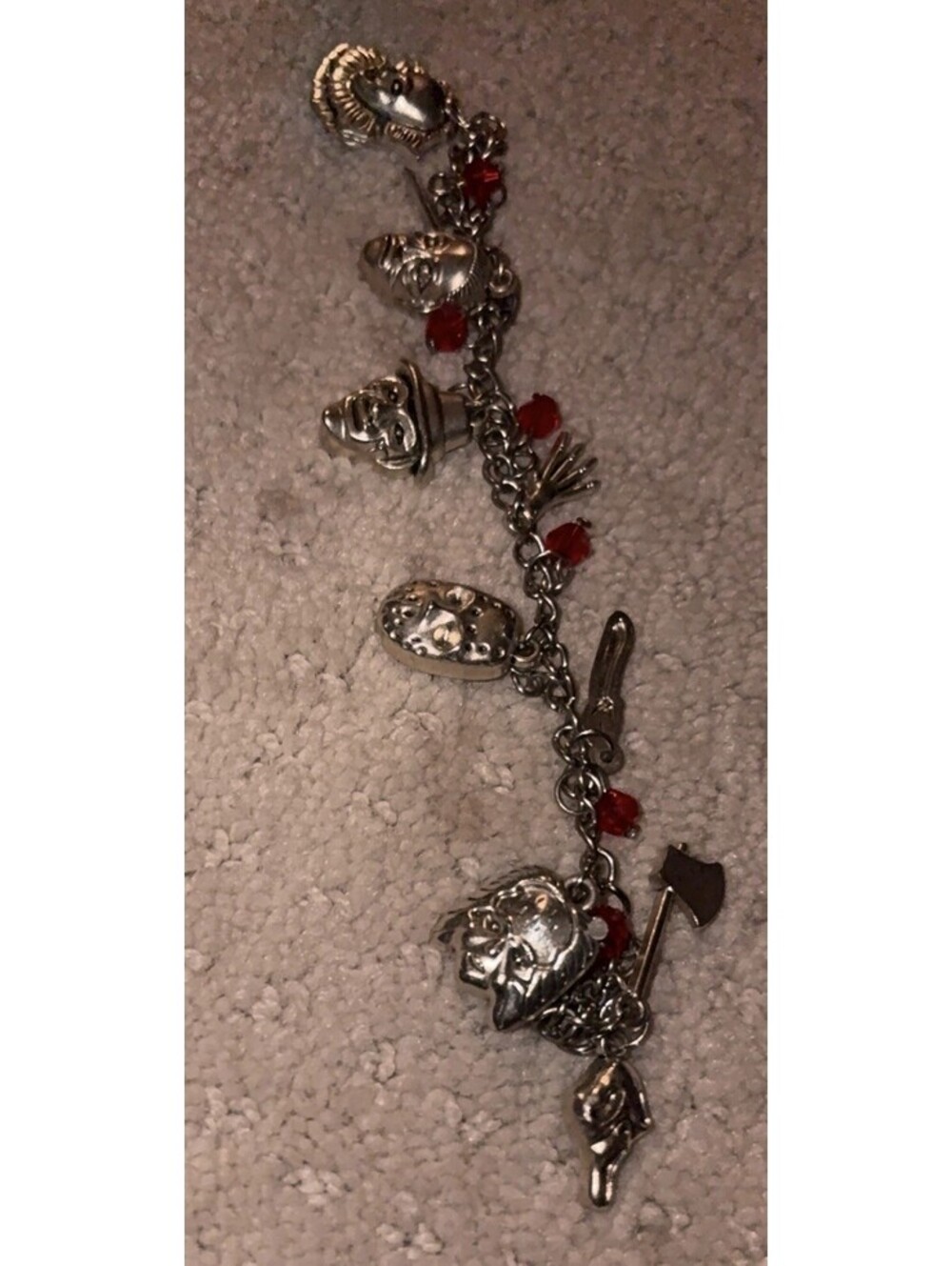Silver Horror Charm Bracelet with Red Accents and Dangle Charms